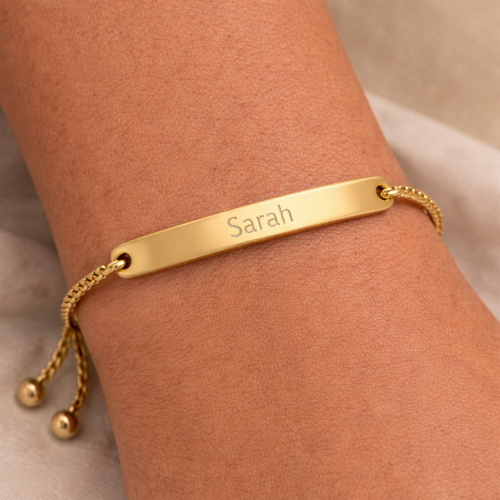 High-end gold bar bracelet styled on woman's wrist