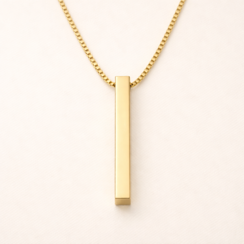 Front view of a minimalist vertical gold bar pendant on a 18k gold plated box chain