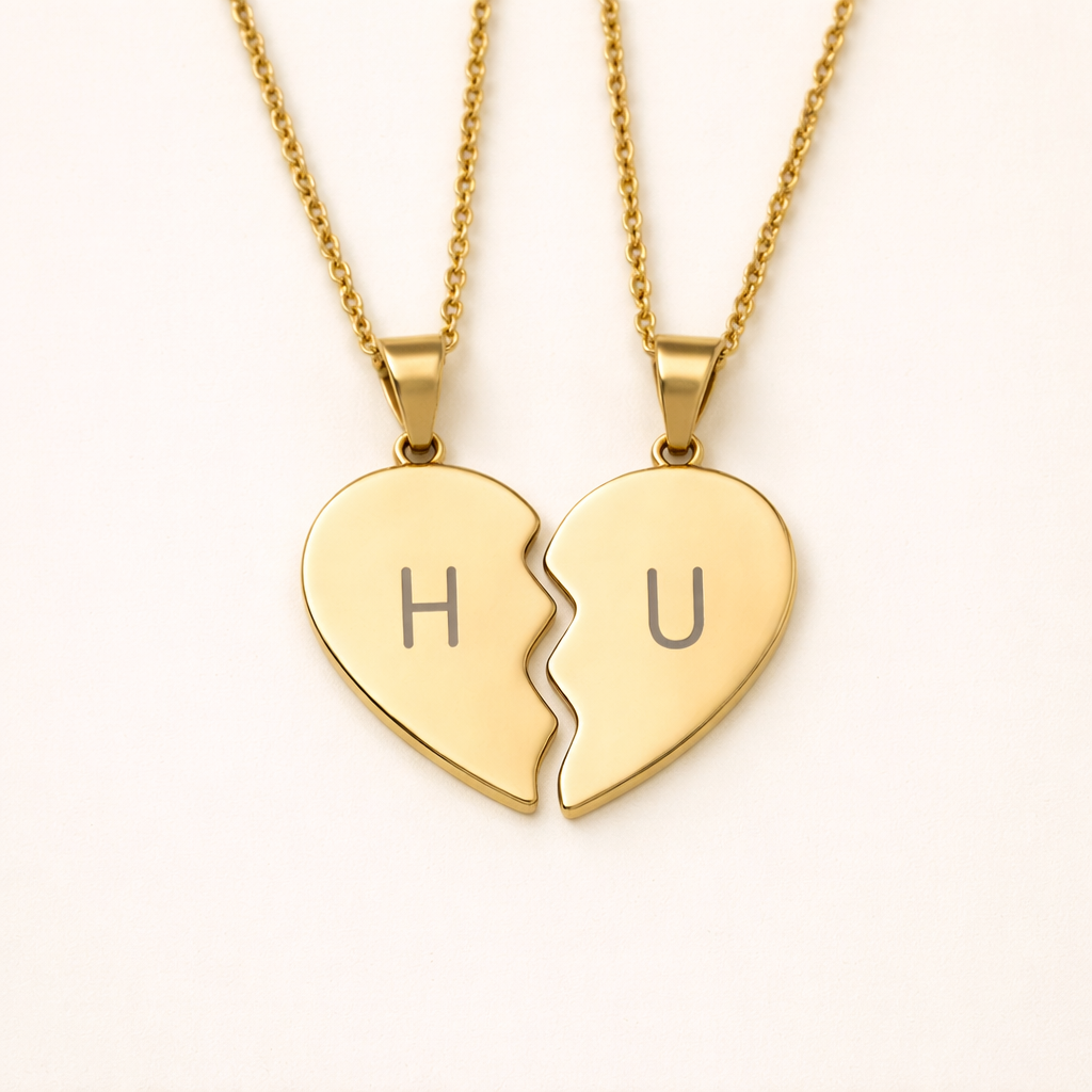 Close-up of 18k gold plated broken heart connection necklace featuring bespoke initials H and U engraving