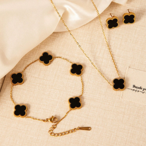 Complete luxury black clover jewellery set including necklace bracelet and earrings by The Gift Maison