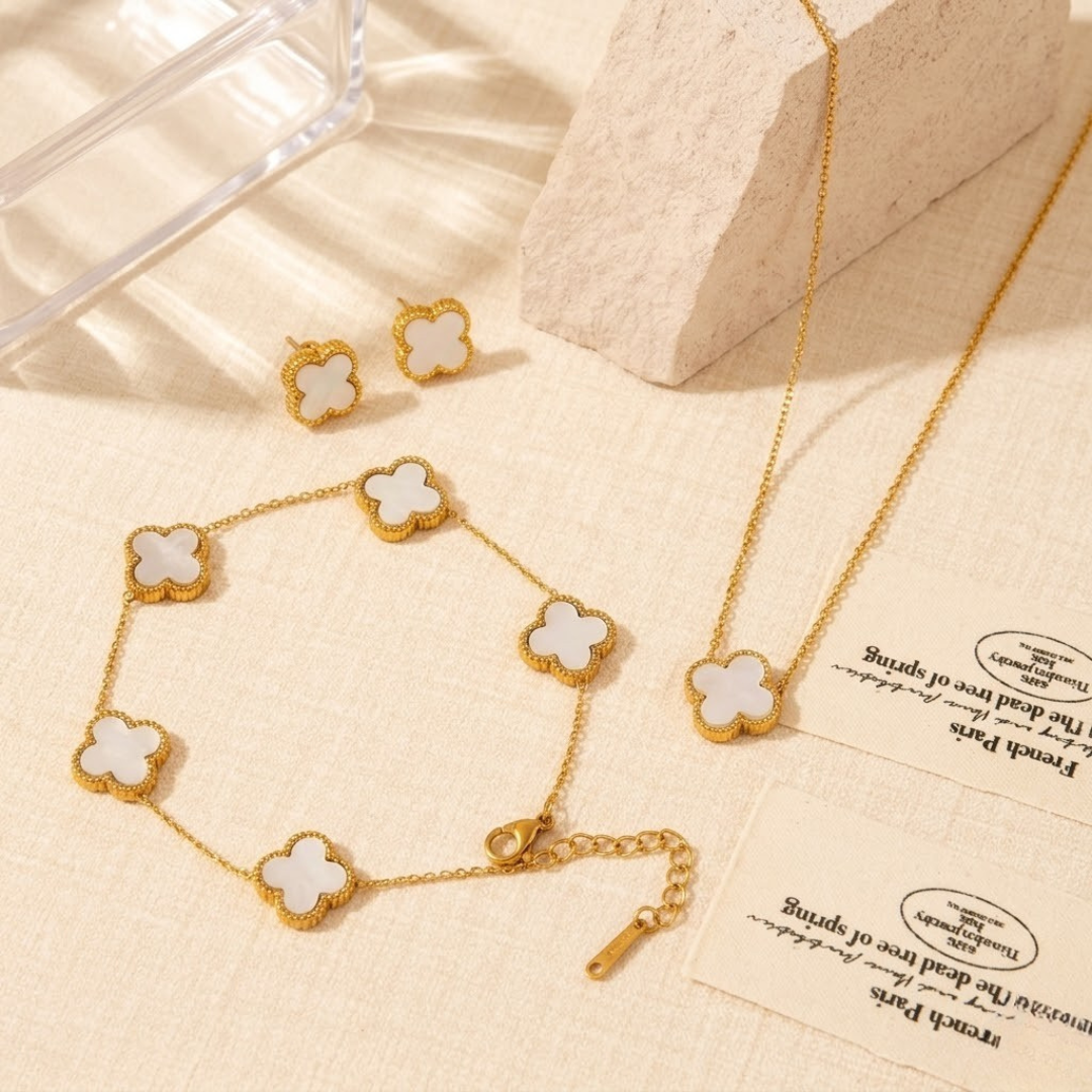 Complete luxury white clover jewelry set featuring matching necklace bracelet and earrings by The Gift Maison