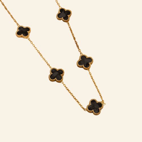 Four leaf clover necklace in black and gold