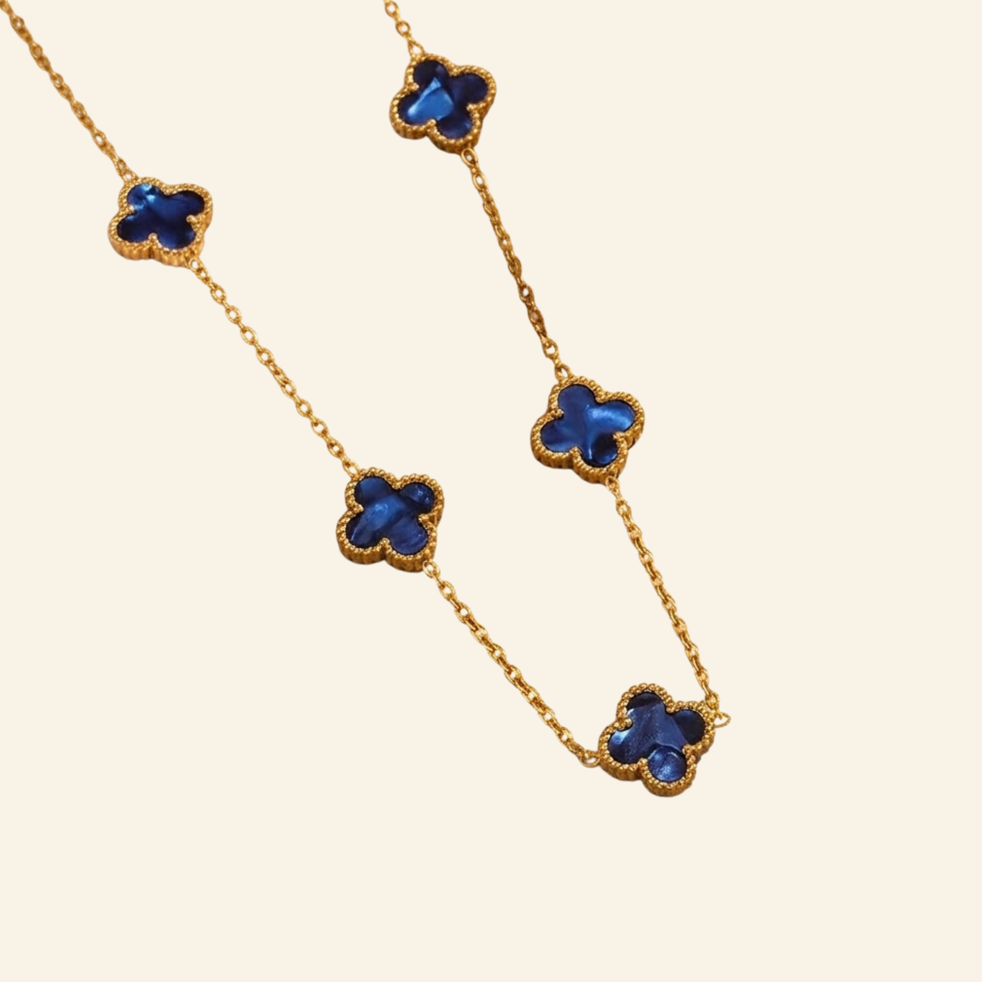 Royal blue four leaf clover necklace, gold plated