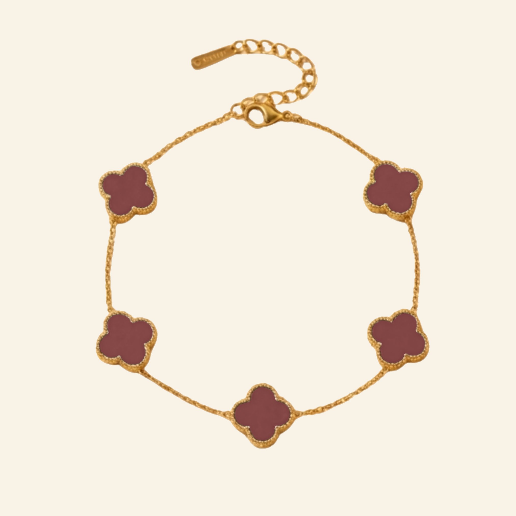 Gold plated clover bracelet with deep burgundy red petals