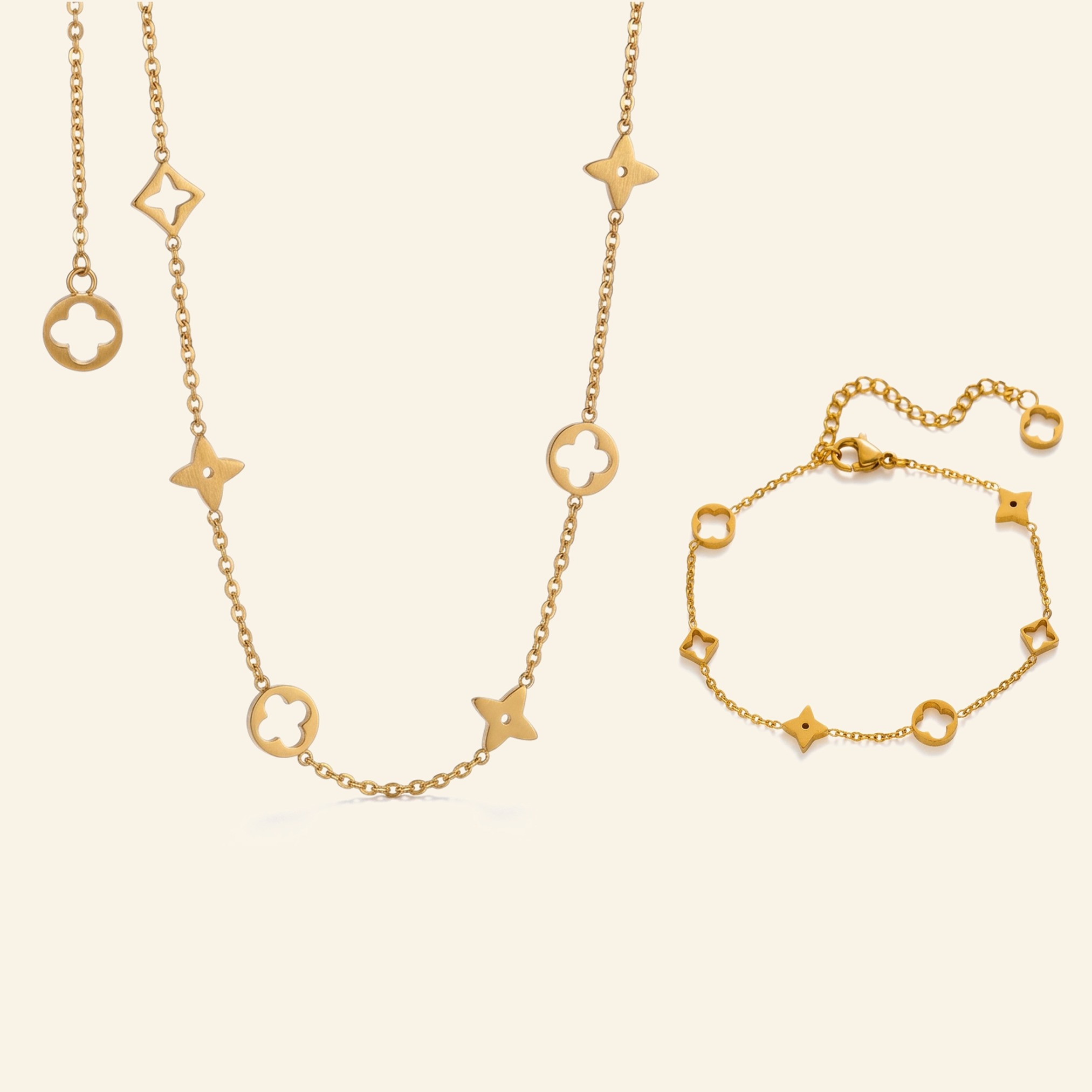 Gold clover charm necklace and matching bracelet with open clover and star charms