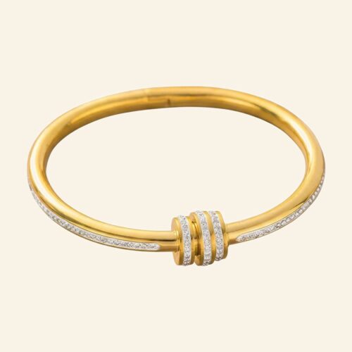 Gold multi ring bangle with crystal-set bands wrapped around the centre