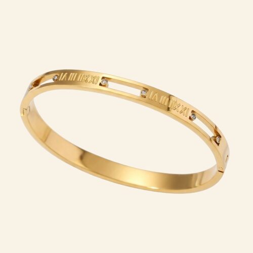 Wide gold roman numeral bangle with cut-out numerals and crystal accents