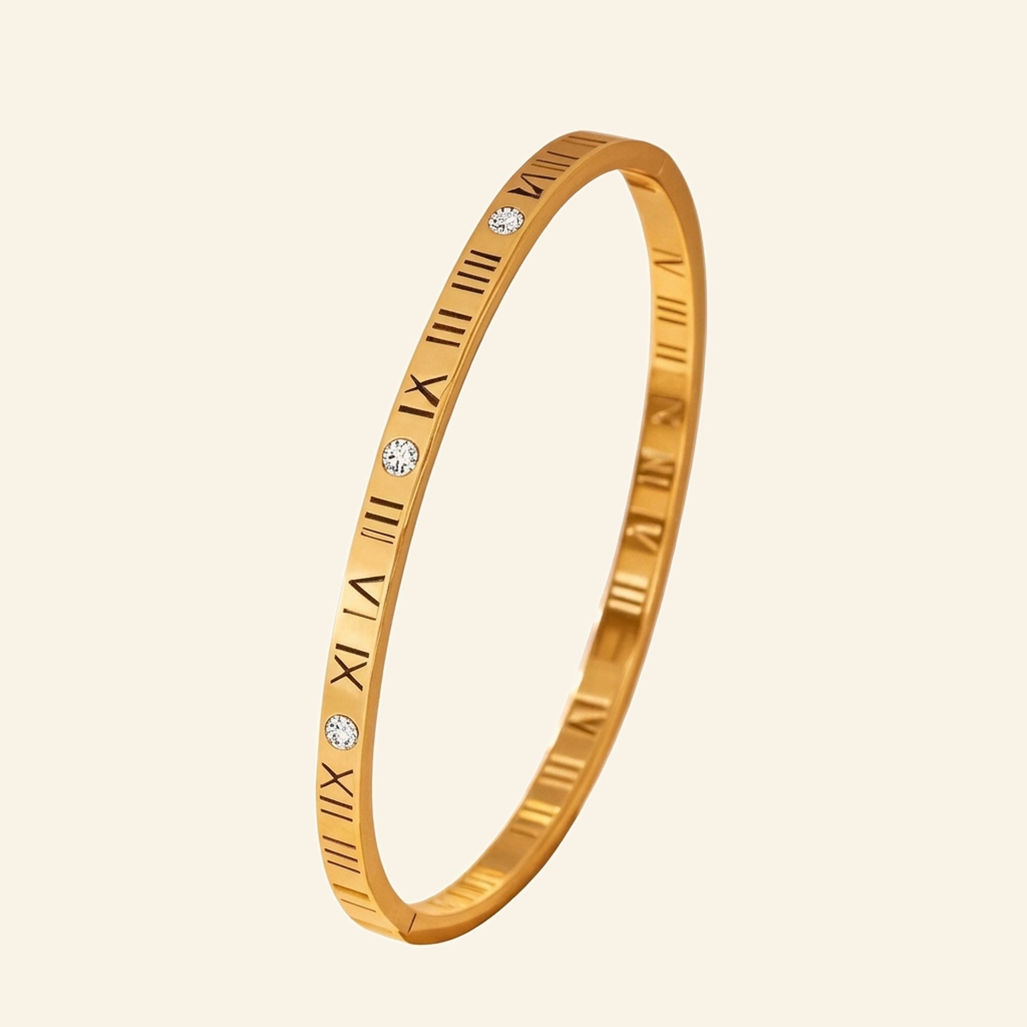 Slim gold roman numeral bangle with open-work numerals and cubic zirconia stones