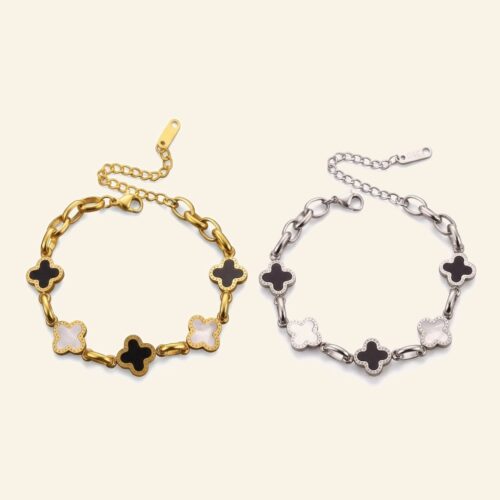 Gold and silver black and white clover bracelets shown side by side
