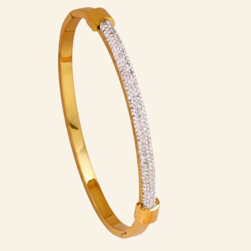 Gold pavé crystal bangle with a wide panel of tightly set sparkling stones