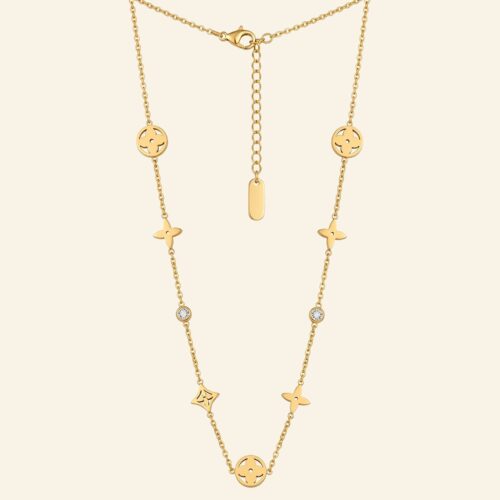 Gold charm necklace with floral medallions, star charms and crystals