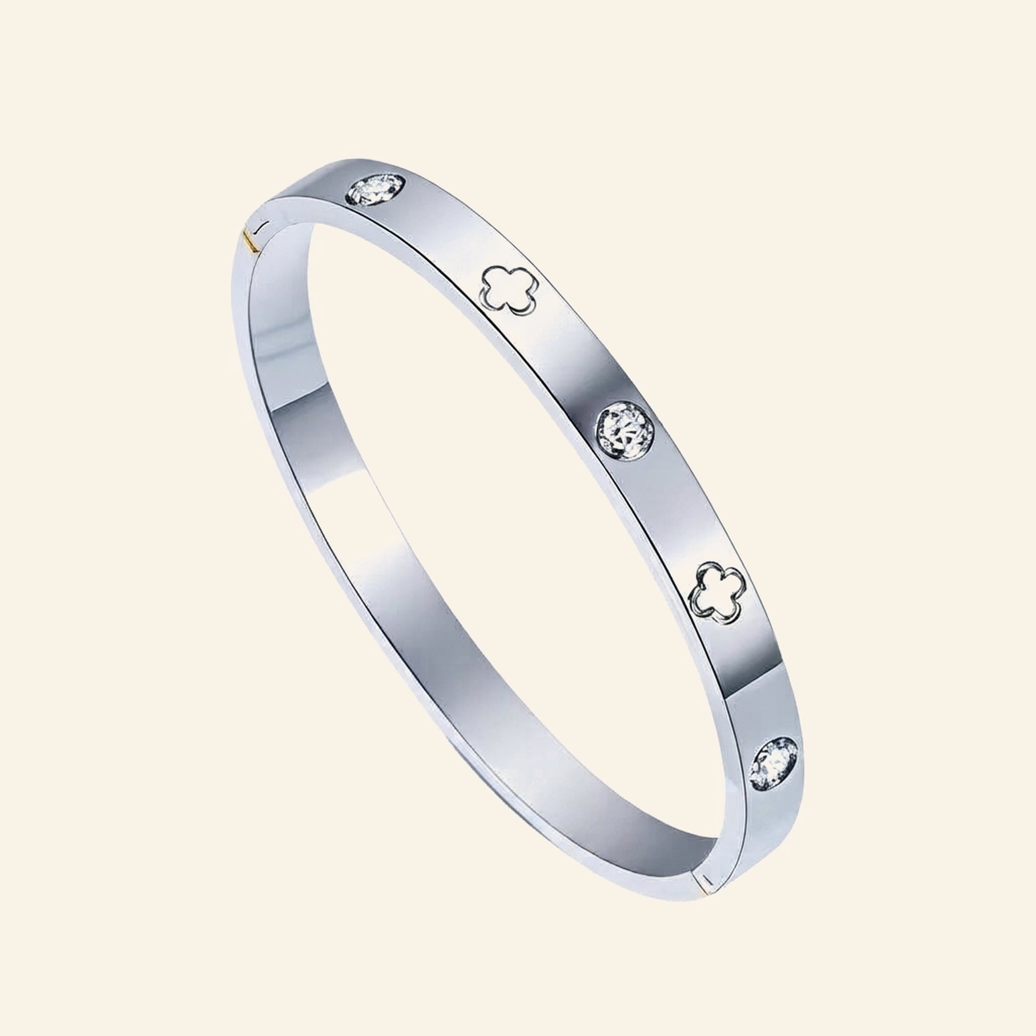 Silver clover bangle with four-leaf clover cut-outs and bezel-set crystals