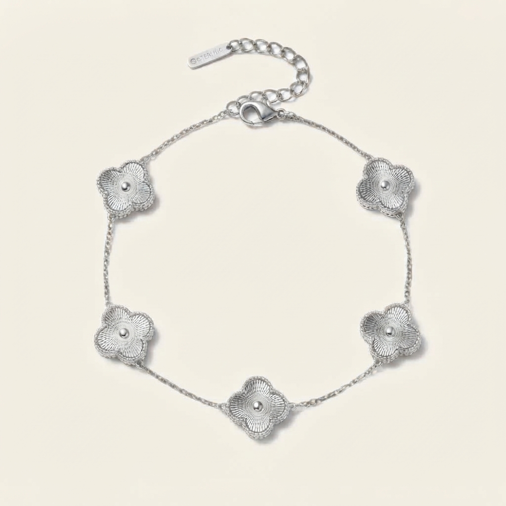 Silver bracelet with five textured four-leaf clovers