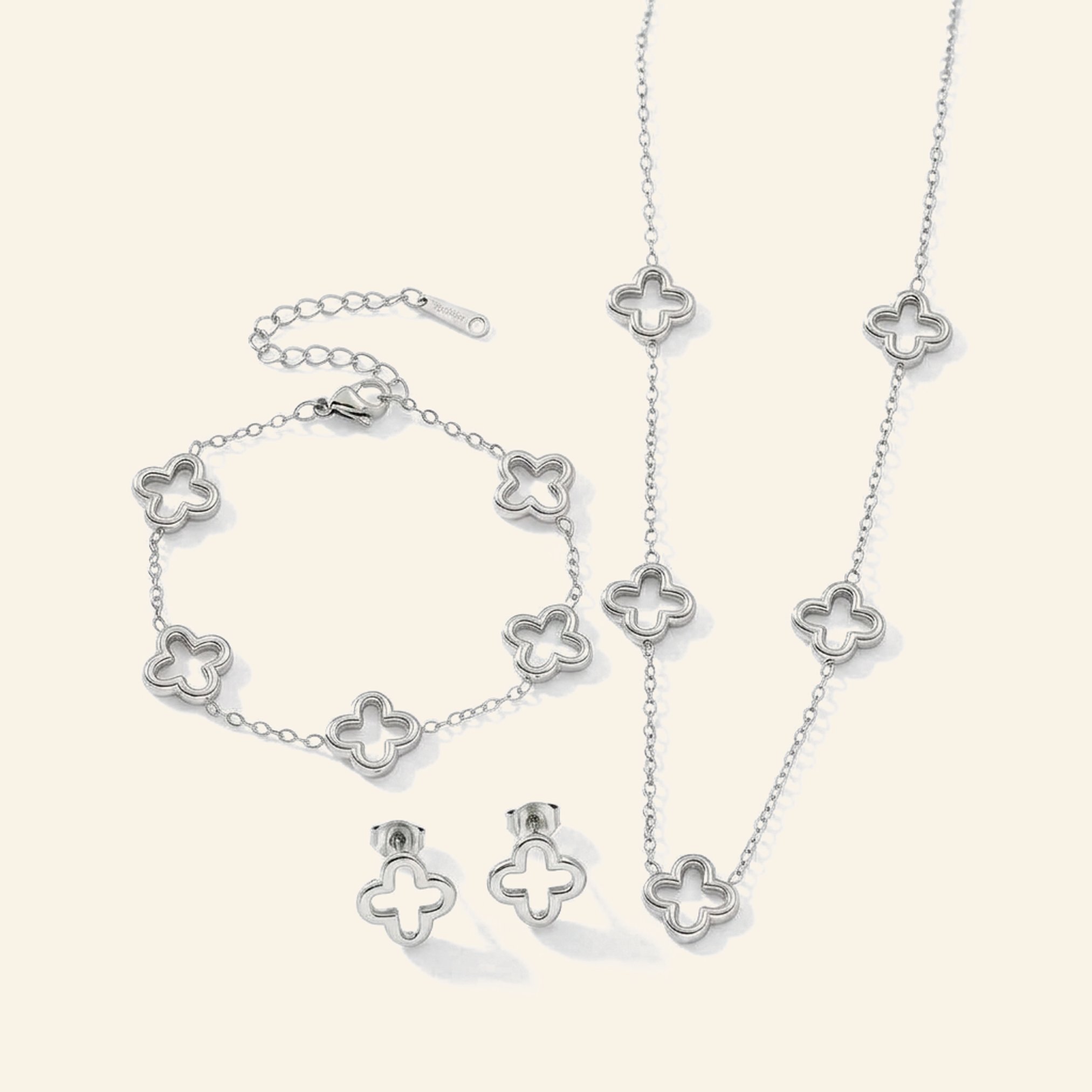 Silver hollow clover set: necklace, bracelet and stud earrings