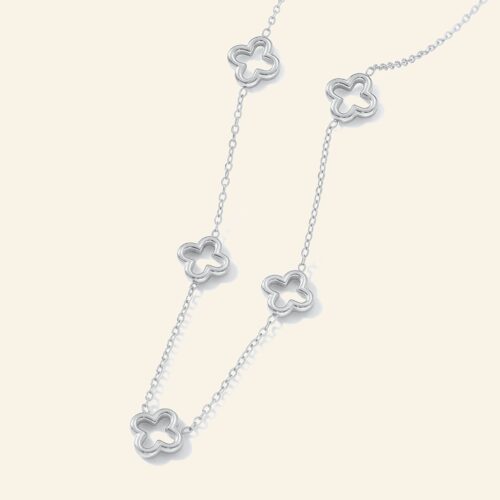 Silver necklace with open hollow four-leaf clover stations