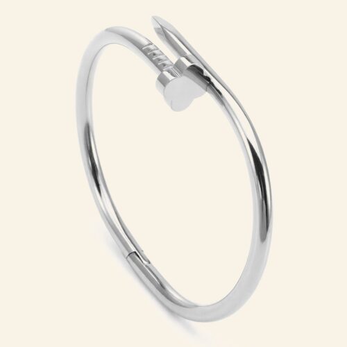 Silver plated nail bangle with a nail-head end wrapping around the wrist