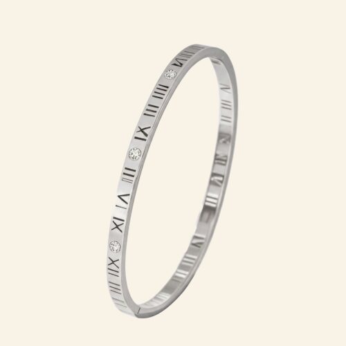 Slim silver roman numeral bangle with open-work numerals and cubic zirconia stones