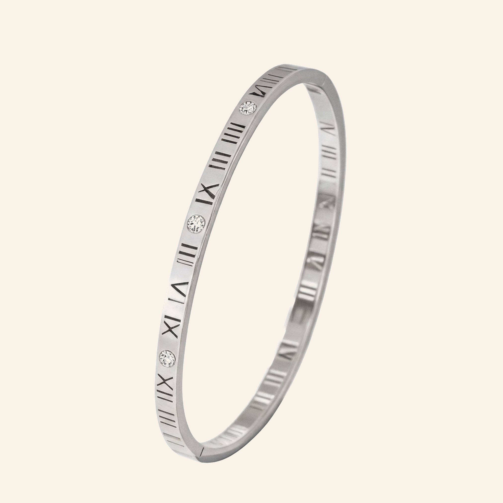 Slim silver roman numeral bangle with open-work numerals and cubic zirconia stones
